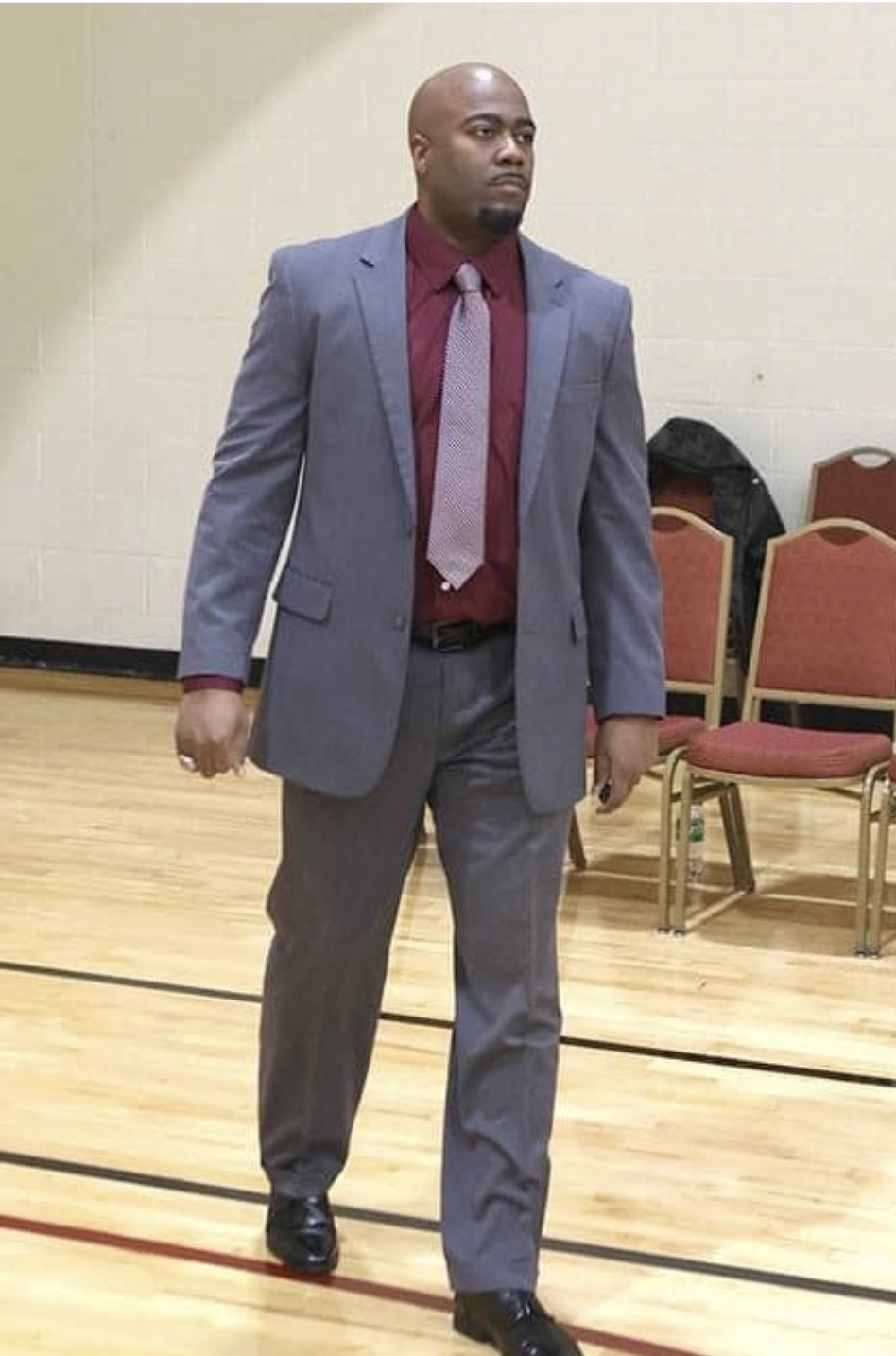 Coach Price game day suit on the court
